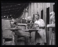 Sculptor Robert Paine working in his studio, Los Angeles, circa 1935