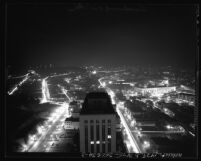 Nighttime cityscape seen from city hall tower looking north, during dim-out in Los Angeles, Calif., 1943