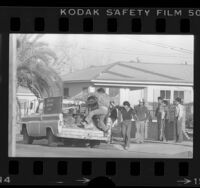 Illegal workers jumping onto truck in Santa Ana, Calif., 1984