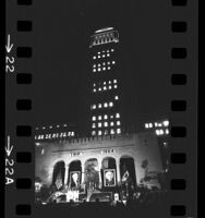 Night scene of Los Angeles City Hall decorated and lighted for Mexico's independence day celebration, 1964