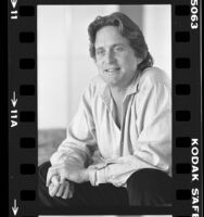 Actor and producer Michael Douglas, seated portrait, 1984