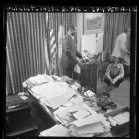 City councilman Tom Bradley, holding press conference on eve of mayoral election in Los Angeles, Calif., 1973