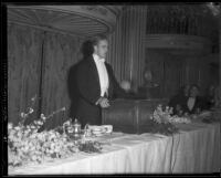 Elliott Roosevelt speaking from behind a lectern, circa 1933