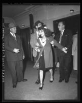 Juvenile officers Tom McGovern and Marty Wynn, try to restrain Doris Derr in Los Angeles, Calif., 1945