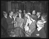 Phil Kerr, radio director of Aimee Semple McPherson's Angelus Temple, interviewing parishioners, 1940