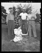 Helen Davidson shows where water company employees tried to install a water meter in Baldwin Park, Calif., 1949