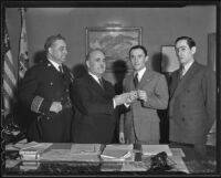 James Davis, Frank Shaw, Florencio Avila Sanchez and Ricardo Hill meet in Shaw's office to discuss a radio broadcast by President Cardenas of Mexico, Los Angeles, 1936