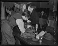 Keith Scruggs tends to his wife Reba when she is stricken by convulsions, Los Angeles, 1938