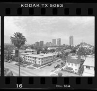 Cityscape of residential area with skyscrapers in background near Century City (Los Angeles), 1987