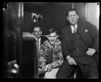 Gordon S. Northcott rides a train bound for San Quentin with his police escorts, Riverside vicinity, circa 1929