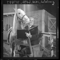 Arthur Lubin, film and TV director, kissing Mr. Ed, 1962