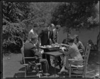 Jack and Ellen Morich serving lunch to members of the press covering the kidnapping of William F. Gettle, Beverly Hills, 1934