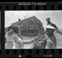 Singer Maria Williams and homeless Daniel Rias participating in Hands Across America in East Los Angeles, Calif., 1986