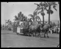 Float with costumed riders and greenery in the parade of the Old Spanish Days Fiesta, Santa Barbara, 1930