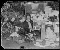 Aimee Semple McPherson with some of her birthday presents, Los Angeles, 1926