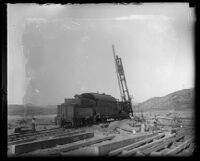 Railroad track repair effort in the valley after the flooding caused by the collapse of the Saint Francis Dam, Santa Clara River Valley (Calif.), 1920s