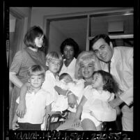 Actress Jayne Mansfield with husband Matt and family leaving Hospital with their newborn son, Antonio in Los Angeles, Calif., 1965