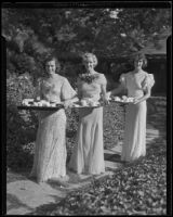 Members of the Assistance Guild carry trays of food and drink at a party hosted by the organization, Los Angeles, 1935