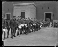 California National Guard members with mess kits outside Exposition Park Armory, Los Angeles