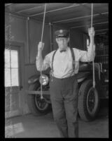 Firefighter William Vickers ringing fire bell, Orange, 1934