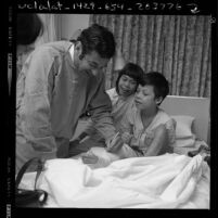 Dr. Leonard M. Linde signing cast for a war injured Vietnamese child hospital in Northridge, Calif., 1970