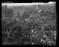 People inspecting damaged houses at scene of electro-plating plant explosion in Los Angeles, Calif., 1947