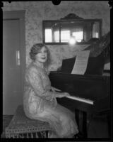 Minnie Kennedy, mother of Aimee Semple McPherson, playing a piano, Los Angeles, 1920-1939