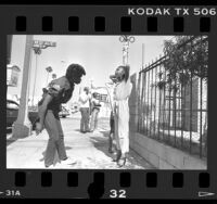 Police officer Geneva Haynes searching suspected drug buyer in Los Angeles, Calif., 1986