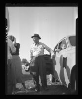 E.W. Kinmore waits as workers attempt to dig into San Marino well wear granddaughter Kathy Fiscus is trapped, 1949