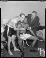 Sugar Ray Robinson receives physical exam before fight, Los Angeles, 1956