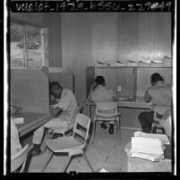 Boys studying class work at Fenner Canyon Job Corps camp, Calif., 1965