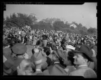 Comedian Bob Hope surrounded by spectators at Los Angeles Times War Workers Golf Tournament in La Canada, Calif., 1943