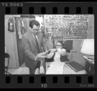 55th Assembly District candidate Richard Polanco filing his absentee ballot in person, Los Angeles, Calif., 1986