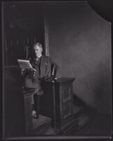 Reverend Gustav A. Briegleb seated at what appears to be a witness stand, Los Angeles, 1920s