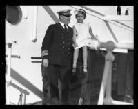 Captain Tom Smith and girl on ship deck, Los Angeles, 1932