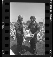 Ministers Norman Stone and Jerry Horn displaying a preserved fetus inside a coffin at Pro-Life rally in Los Angeles, Calif., 1985