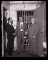 Jailer Clem Peoples, prisoner Asa Keyes and Sheriff Frank Cochran at the county jail, Los Angeles, 1930