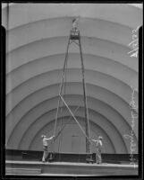 Martin Sipma painting the shell of the Hollywood Bowl, Los Angeles, 1935