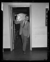 Actor Henry Fonda with seabag on shoulder after enlisting in United States Navy, 1942