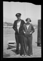 Mr. and Mrs. G. L. Stevens stand on a boat dock, California