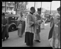 Bishop Cantwell, John Cawley and others entering the St. Patrick Catholic Church to attend the mass for St. John Bosco, Los Angeles, 1935
