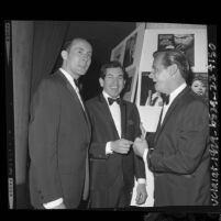 Henry Mancini, Trini Lopez and John Gary backstage at the Grammy Awards dinner, 1964