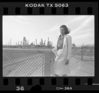 Sabrina Schiller outside Golden West oil refinery in La Mirada, Calif., 1986