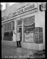 Orville Clark stands before his drug store, Los Angeles, 1938