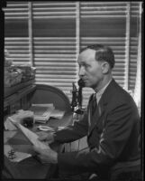 William Kerr, Los Angeles County Registrar of Voters at his desk, Los Angeles, 1924-1939