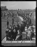 Graduates of Loyola College proceed in a line to walk at commencement, Los Angeles, 1935