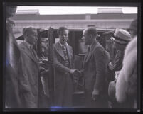 Stunt driver Hayward Thompson shaking hands with manager W. H. Watson, Los Angeles, 1927