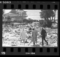 People walking amid storm debris in Redondo Beach, Calif., 1987