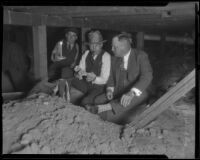 George Contreras, county investigator, and Asa Keyes, district attorney, at a crime scene in a basement, Los Angeles, 1924-1929