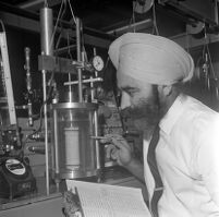 Awtar Singh examines soil sample from Mount Washington landslide, Los Angeles, 1969